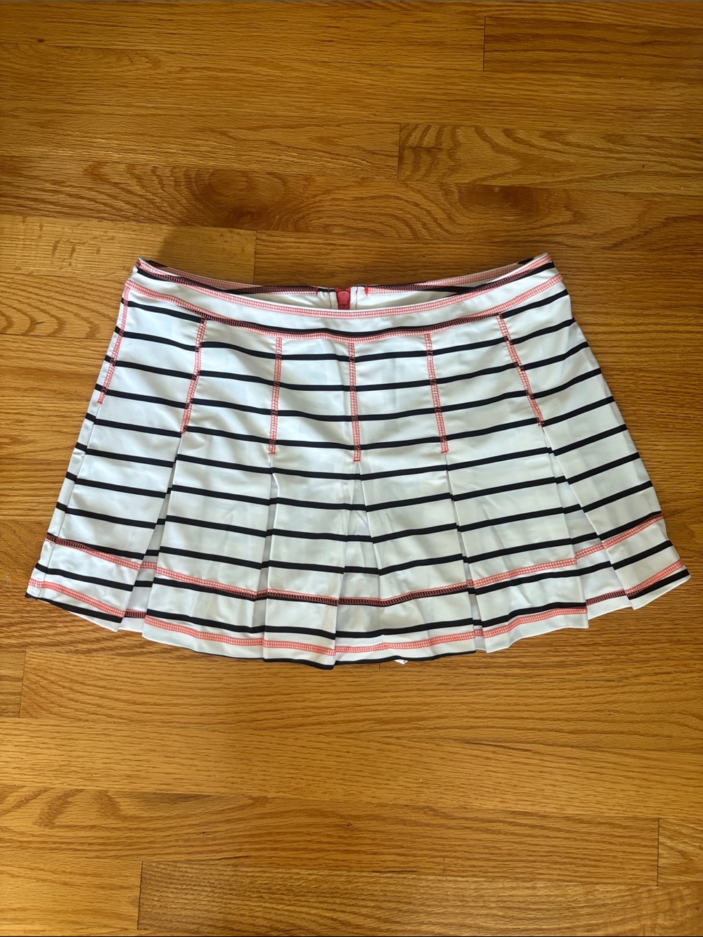 Sail to Sable White and Navy Striped Pleated Mini Skort with Coral Trim